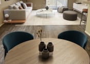 Thumbnail 2 of 12 - a living room with a couch and a table