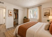 Thumbnail 9 of 45 - A bedroom with a large bed and a wardrobe.
