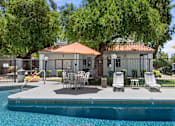 Thumbnail 24 of 42 - A pool with a patio and chairs.