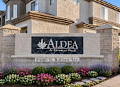 Thumbnail 25 of 25 - A stone sign with the name Aldea at Estrella Falls on it.