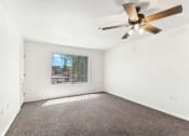 Thumbnail 16 of 36 - Bedroom with Ceiling Fan at Somerset Village in Kingman Arizona