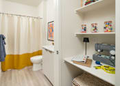 Thumbnail 5 of 11 - Built in desk and bathroom at Streamliner 87th Apartments