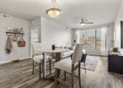 Thumbnail 5 of 48 - Dining area and living room at V on Broadway Apartments in Tempe AZ November 2020