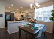 Thumbnail 13 of 60 - Dining area breakfast bar and kitchen at San Vicente Townhomes in Phoenix AZ