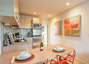 Thumbnail 2 of 60 - Dining room and kitchen at The Regency Apartments in Tempe Arizona July 2020