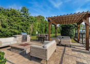 Thumbnail 15 of 42 - Firepit grill area at Laurel Valley Apartments in Mount Juliet Tennessee March 2021