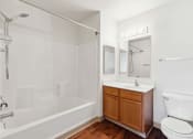 Thumbnail 6 of 36 - a bathroom with a toilet sink and bathtub