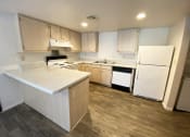 Thumbnail 6 of 23 - Kitchen  at University West Apartments in Flagstaff AZ April 2021