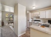 Thumbnail 3 of 32 - Kitchen and common area at Copper Ridge Apartments in Kingman