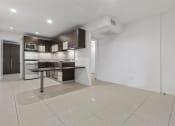 Thumbnail 41 of 60 - Kitchen and dining area at The Regency Apartments in Tempe AZ Nov 2020