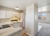Thumbnail 8 of 32 - Kitchen and Living Room at Copper Ridge Apartments in Kingman Arizona