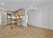 Thumbnail 39 of 60 - Kitchen and living room at The Regency Apartments in Tempe AZ Nov 2020
