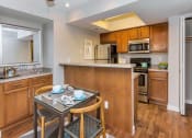 Thumbnail 2 of 19 - Kitchen and Wet Bar at Olive East Apartments