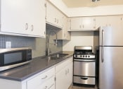 Thumbnail 9 of 23 - Kitchen at Carol Mary Apartments in Phoenix, AZ