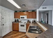 Thumbnail 4 of 19 - Kitchen at Desert Sage Apartments in Goodyear Arizona