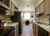 Thumbnail 7 of 64 - Kitchen at The Villas at Quail Creek Apartment Homes in Austin Texas