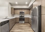 Thumbnail 28 of 48 - Kitchen at V on Broadway Apartments in Tempe AZ November 2020 (5)