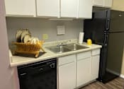 Thumbnail 6 of 13 - Kitchen at Wellington Estates Apartments in San Antonio TX