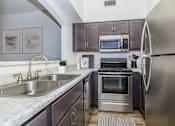 Thumbnail 11 of 65 - Kitchen at Winterhaven Apartments in Tucson Arizona