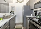 Thumbnail 2 of 65 - Kitchen at Winterhaven Apartments in Tucson Arizona