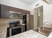 Thumbnail 20 of 65 - Kitchen at Winterhaven Terrace Apartments in Tucson Arizona