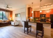 Thumbnail 3 of 16 - Kitchen with Breakfast Bar at Canyon Crossroads Apartment Homes in Phoenix AZ