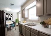 Thumbnail 17 of 64 - Kitchen with Window View at The Villas at Quail Creek Apartment Homes in Austin Texas