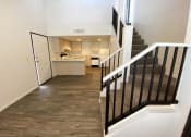 Thumbnail 4 of 23 - Living Room and Stairs at University West Apartments in Flagstaff AZ April 2021