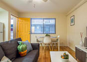 Thumbnail 14 of 22 - Living Room Dining Area at University Lofts Apartments near University of Arizona in Tucson Arizona