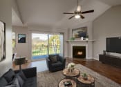 Thumbnail 4 of 64 - Living Room with Balcony at The Villas at Quail Creek Apartment Homes in Austin Texas