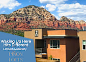 Thumbnail 1 of 33 - A Pinon Lofts sign is displayed in front of a modern house with a mountain in the background.