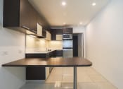 Thumbnail 21 of 60 - Kitchen (Unfurnished 1 Bedroom) at The Regency Apartments in Tempe, AZ