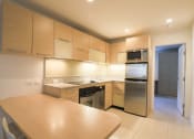 Thumbnail 18 of 60 - Kitchen (Furnished 1 Bedroom) at The Regency Apartments in Tempe, AZ