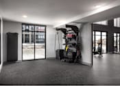 Thumbnail 13 of 28 - A room with a grey carpet and a black and white striped wall.