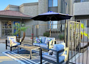 Thumbnail 17 of 19 - Pool Seating Area and Gym Entrance at Olive East Apartment in Gilbert Arizona 2025.png