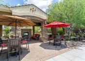 Thumbnail 10 of 16 - Pool Seating Area at Canyon Crossroads Apartment Homes in Phoenix AZ