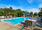 Thumbnail 12 of 42 - Pool seating at Laurel Valley Apartments in Mount Juliet Tennessee March 2021