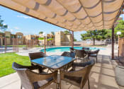 Thumbnail 21 of 32 - Shaded Pool Area at Copper Ridge Apartments in Kingman Arizona