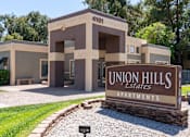 Thumbnail 15 of 17 - The image shows a building with the number 4101 and the name Union Hills Estates Apartments.