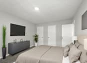 Thumbnail 6 of 26 - A bedroom with a large bed and a flat screen TV mounted on the wall.