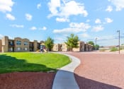 Thumbnail 25 of 32 - Walking Path and Playground at Copper Ridge Apartments in Kingman Arizona