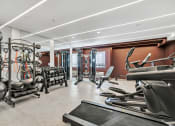 Thumbnail 13 of 37 - a gym with weights and cardio equipment and a window at The Meriden, Connecticut