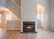 Thumbnail 15 of 22 - Living Area With Fireplace at Ardenwood Apartments, North Haven, Connecticut