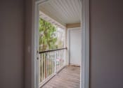 Thumbnail 5 of 22 - the view of a balcony from a room with a door open at Ardenwood Apartments, North Haven, Connecticut
