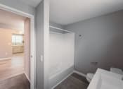 Thumbnail 7 of 24 - a bathroom with a tub and a sink and a mirror at BAY SHORE APARTMENTS, EAST HAVEN, CT, 06512