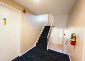 Thumbnail 23 of 24 - Living Area With Staircase at BAY SHORE APARTMENTS, Connecticut, 06512