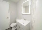 Thumbnail 15 of 19 - a bathroom with a sink toilet and a mirror  at Enclave West Hartford / Parc West, West Hartford, Connecticut