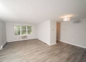 Thumbnail 2 of 19 - a living room with wood floors and white walls and a window  at Enclave West Hartford / Parc West, West Hartford