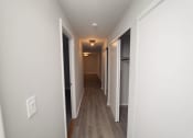 Thumbnail 19 of 19 - a pass through hallway in a new home with white walls and wood floors  at Enclave West Hartford / Parc West, Connecticut, 06110