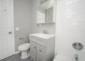 Thumbnail 37 of 39 - a white bathroom with a sink and a toilet at Encore 99, Connecticut, 06512